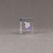 Angle view of x-small Allure™ Floating Acrylic Encasement Award with Alcon medical device sample encased into clear acrylic showing full color imprint.