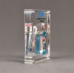 Side view of x-large Allure™ Acrylic Encasement Award with Colgate toothpaste and mouthwash bottle encased into clear acrylic showing full color imprint.