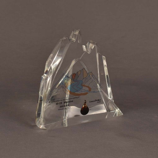 Angled view of mini Lucite® award highlighting etched details and geometric mountain-inspired form