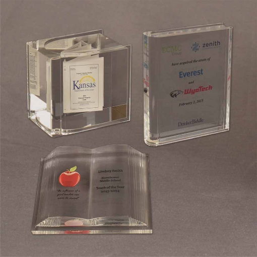 Group display of three Book Shaped Embedments: Open Book, Thick Book, and Slim Book styles with custom full color graphics.