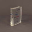 Side profile of small slim Lucite® embedment shaped like a book spine, emphasizing its thin depth and polished edge design