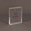 Angled view of small slim book-shaped Lucite® embedment with embedded text and corporate logos in a sleek, compact acrylic form