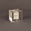 Angled view of Thick Book Lucite® Embedment with suspended multi-page booklet inside crystal-clear acrylic, creating a floating paper effect