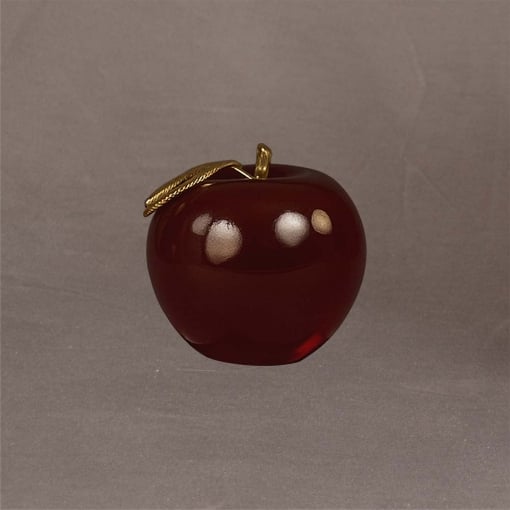Small 3D red apple award with gold leaf accent, shown at an angle to highlight its shape and acrylic craftsmanship.