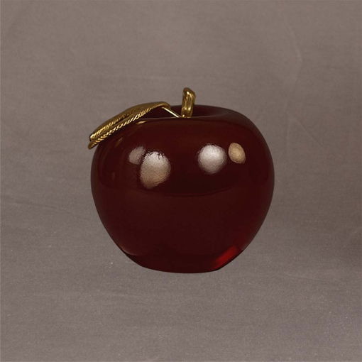 Elegant medium red apple sculpture with a golden leaf, shown at a graceful angle to emphasize its smooth form and glossy surface.