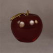 Large red Lucite® apple award with gold leaf accent, viewed at an angle to emphasize its grand size and smooth, lustrous finish.