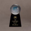 Large Lucite® sphere award with blue logo, mounted on a glossy black acrylic base with gold engraving for top-tier recognition