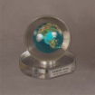 Large Lucite® award featuring detailed globe imagery and personalized nameplate, ideal for international leadership recognition