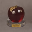 Large ruby red acrylic apple set atop a clear Lucite® base with a custom nameplate—perfect for prestigious educator awards.